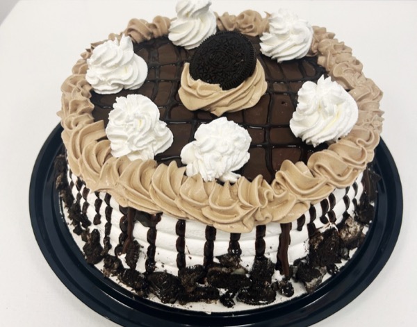 Custom decorated ice cream cake with colorful frosting and toppings